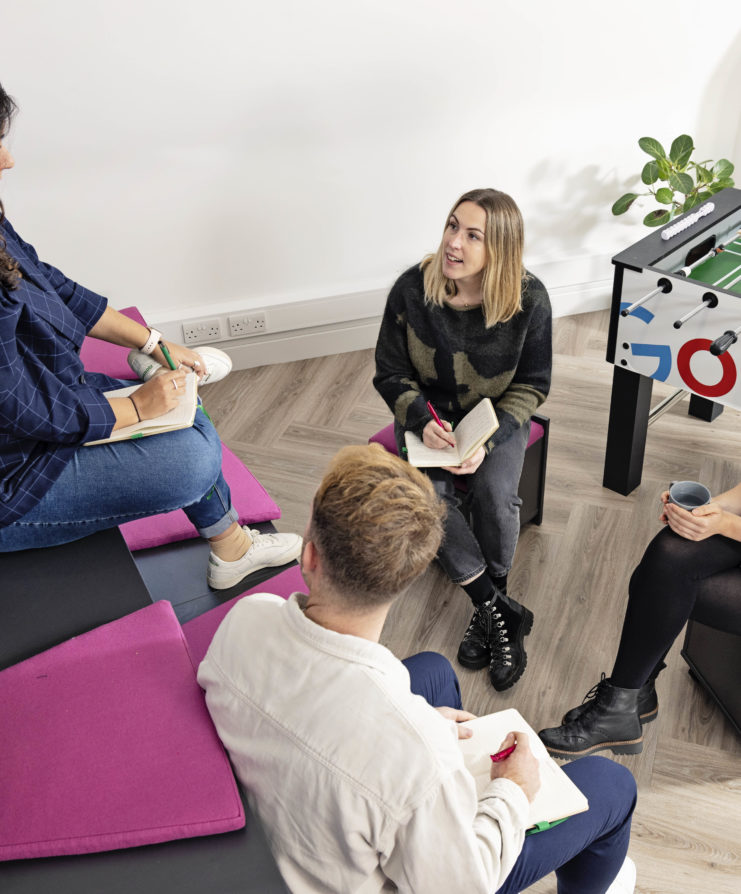 Photograph of Fountain Team members working together on digital marketing client work.